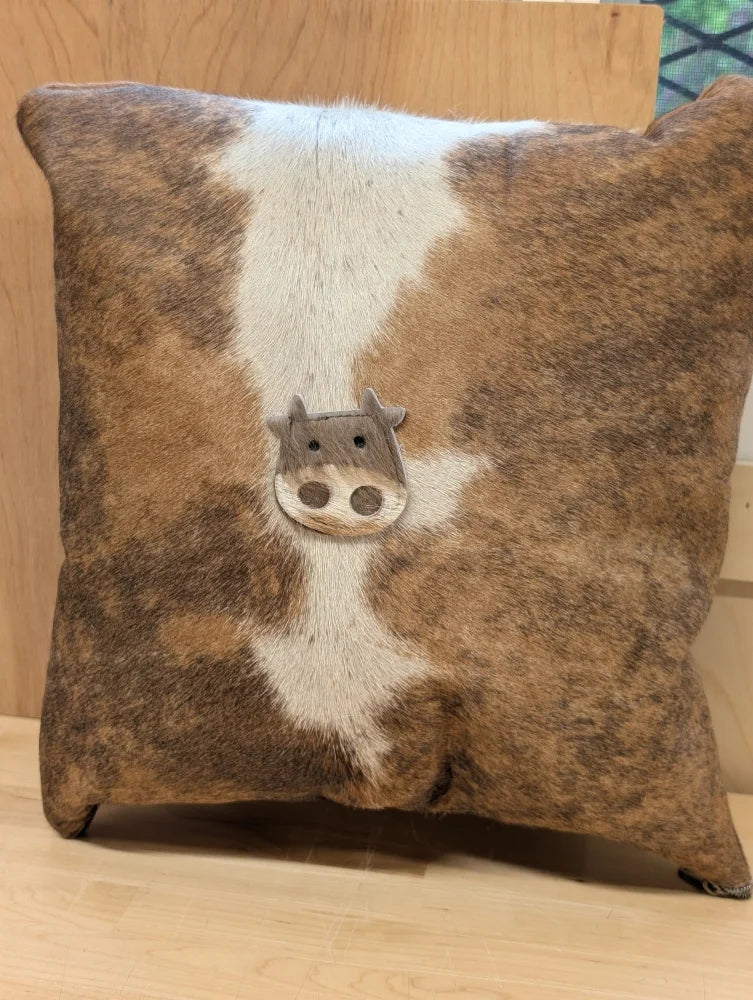 Mini moo double sided cowhide cushion with brown and white cowhide and stitched-on cow face from angus oliver canada