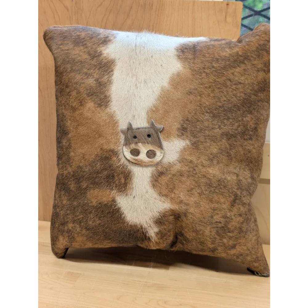 Mini moo double sided cowhide cushion with brown and white cowhide and stitched-on cow face from angus oliver canada