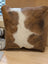 Brown and white mini moo cowhide pillow with natural fur texture by angus oliver canada perfect for cozy decor