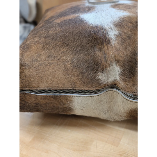 Brown and white cowhide mini moo cushion with visible zipper edge by angus oliver canada
