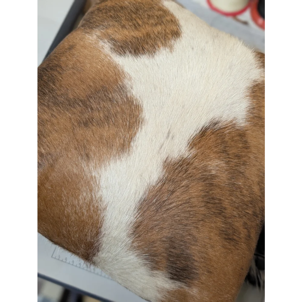 Brown and white mini moo double sided cowhide cushion with natural fur texture by angus oliver canada