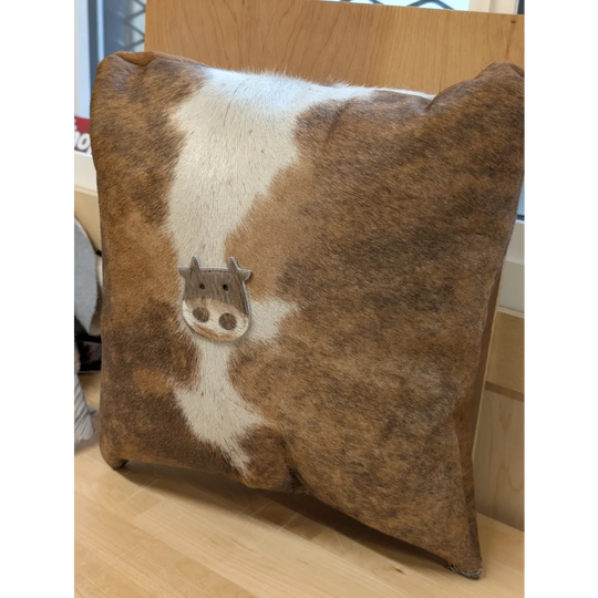 Brown and white cowhide mini moo cushion with stitched cow face appliqué by angus oliver canada