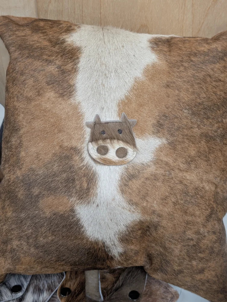 Brown and white cowhide mini moo cushion by angus oliver canada with stitched cow face appliqué double sided pillow