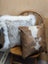 Brown and white cowhide mini moo cushion with stitched cow face design by angus oliver canada