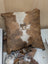 Brown and white cowhide mini moo cushion with stitched cow face design by angus oliver canada