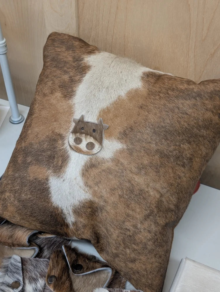 Brown and white cow print mini moo throw pillow with stitched cow face appliqué by angus oliver canada