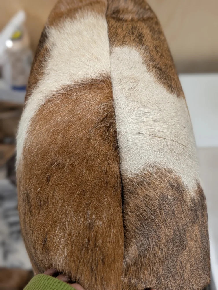 Mini moo double sided cowhide cushion by angus oliver canada with plush brown and white fur soft textured surface