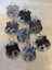 Mini moo cow-shaped keychains from angus oliver canada made with brown and white stitched cowhide details