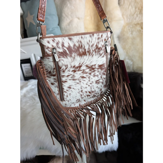 Mojave tassel bag in brown speckled cowhide with fringe and tooled straps