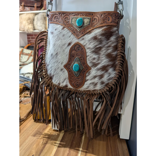 Mojave tassel bag in brown hunter leather with white cowhide fringe