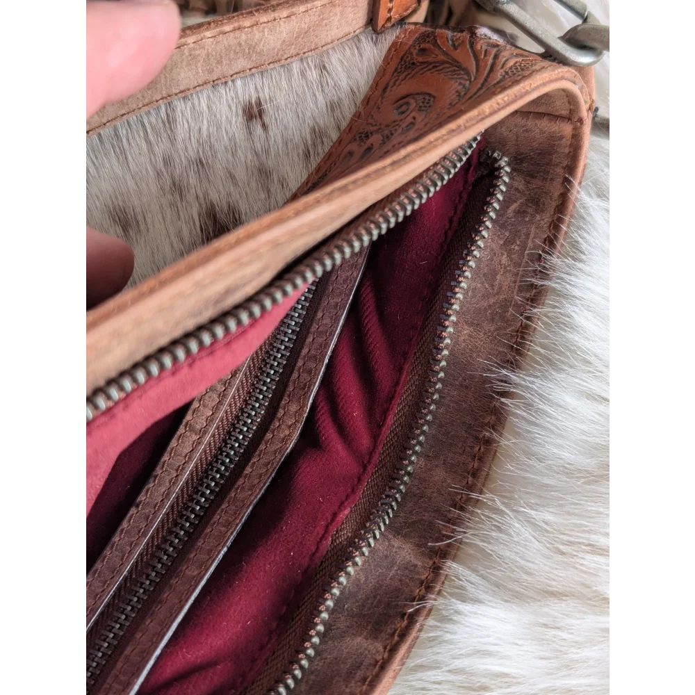 Mojave tassel bag in brown speckled hunter leather with maroon lining