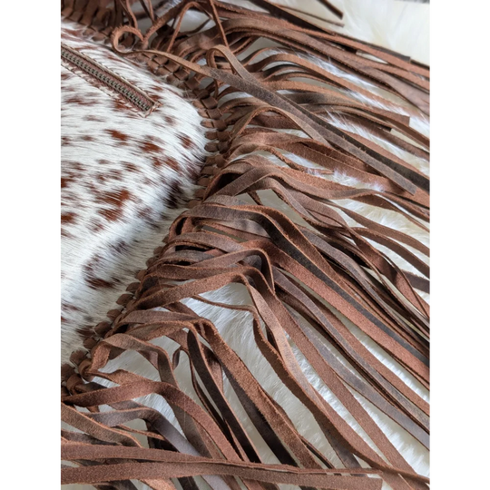 Mojave tassel bag with brown hunter leather fringe on cowhide clutch