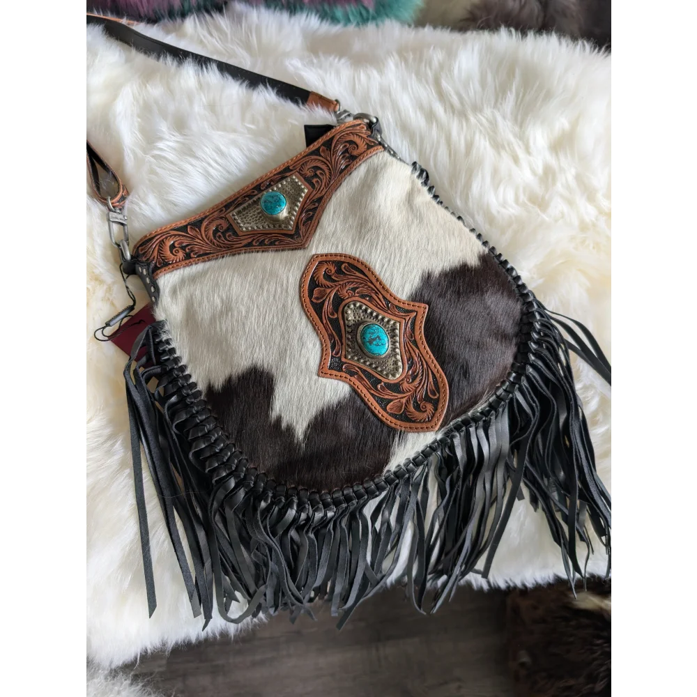 Mojave tassel bag in dark brown white cowhide with hunter leather accents