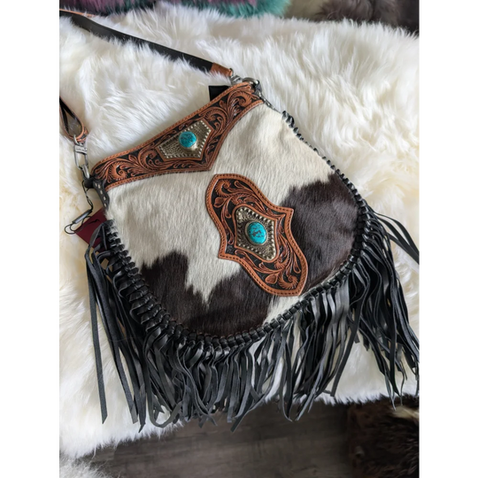 Mojave tassel bag in dark brown white cowhide with hunter leather accents