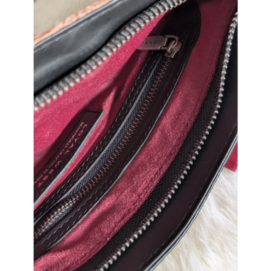 Mojave tassel bag in black hunter leather with maroon interior, silver zippers