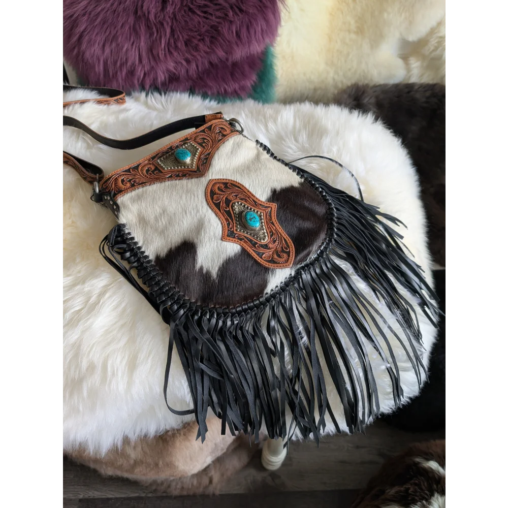 Mojave tassel bag in dark brown white cowhide with hunter leather accents
