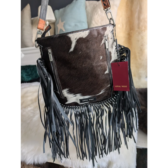 Mojave tassel bag in dark brown white cowhide with hunter leather fringe