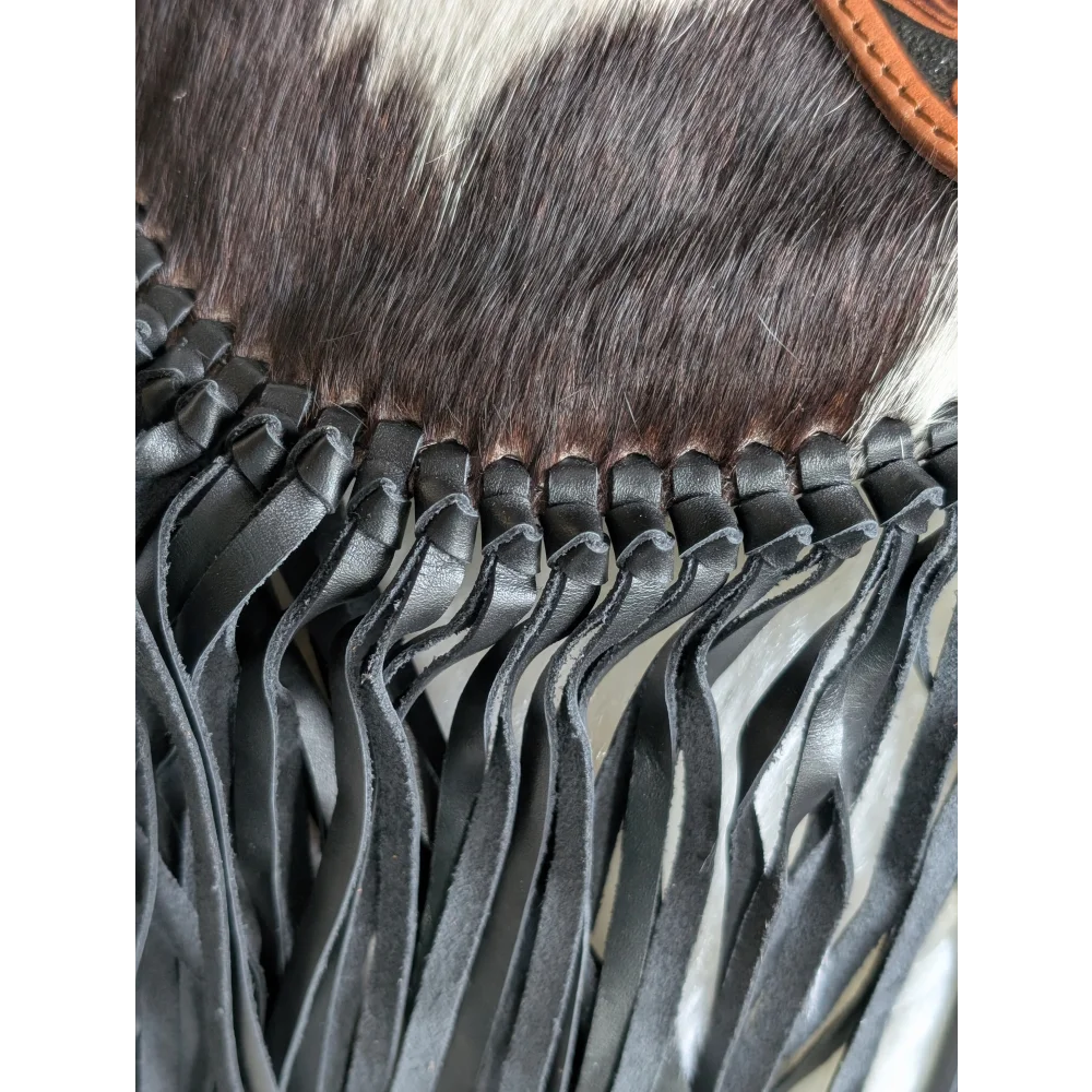 Mojave tassel bag with black hunter leather fringe on cowhide fur top