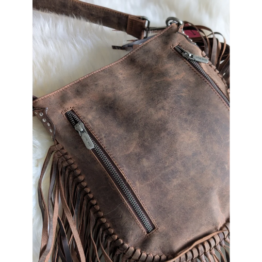 Mojave tassel bag in hunter leather with fringes and stitching