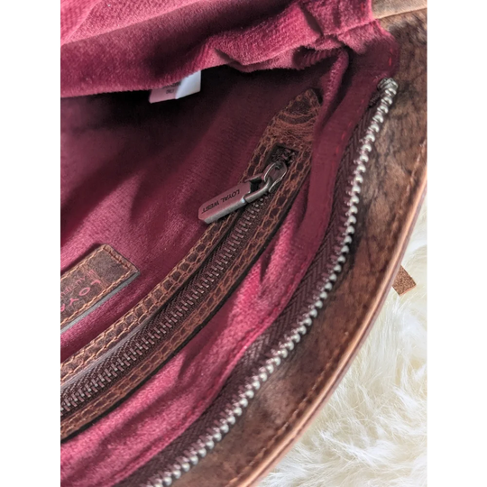 Mojave tassel bag in hunter leather with burgundy velvet lining