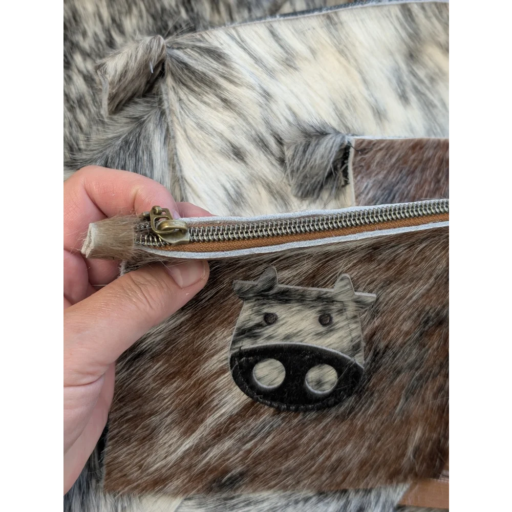 Moo coin purse by angus oliver canada with cow-print leather zipper pull and spotted brown gray hide exterior