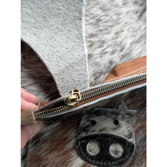 Gray and brown cowhide coin purse with brass zipper pull from angus oliver canada called moo coin purse