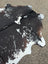 Large cowhide rug moon1 with black white and natural brown patches showing unique characteristics