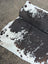 Moon#1 96 x 82 large cowhide rug with black white and natural brown speckles showcasing unique characteristics