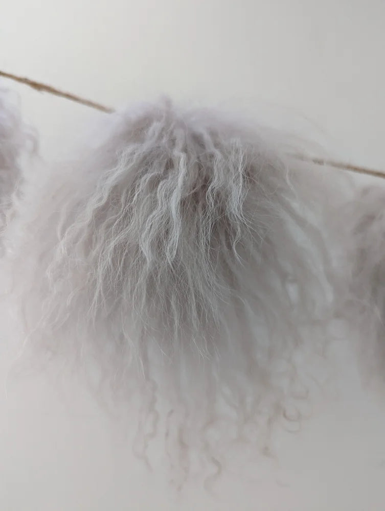Cozy white mushroom sheepskin pom pillow with tassels