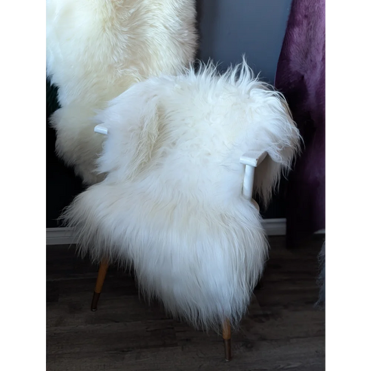 Modern white Icelandic sheepskin chair with wooden legs