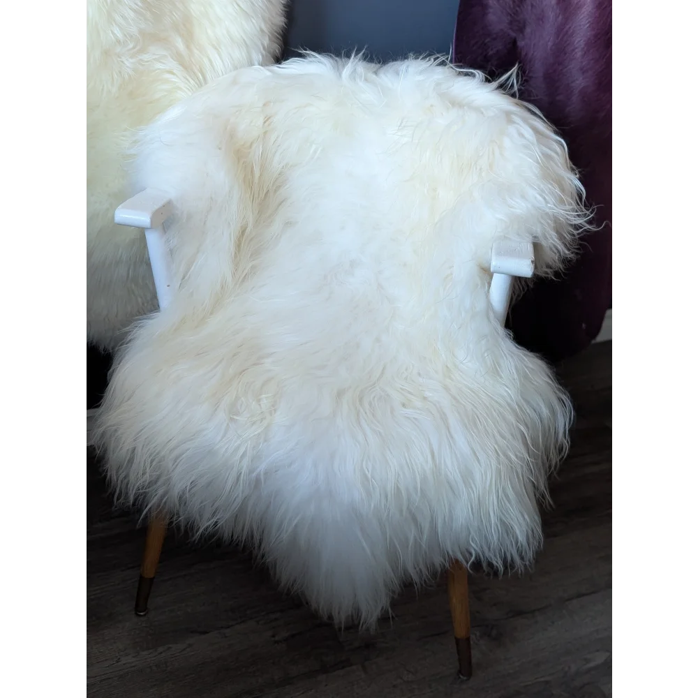 Natural white Icelandic sheepskin chair cover with wooden legs