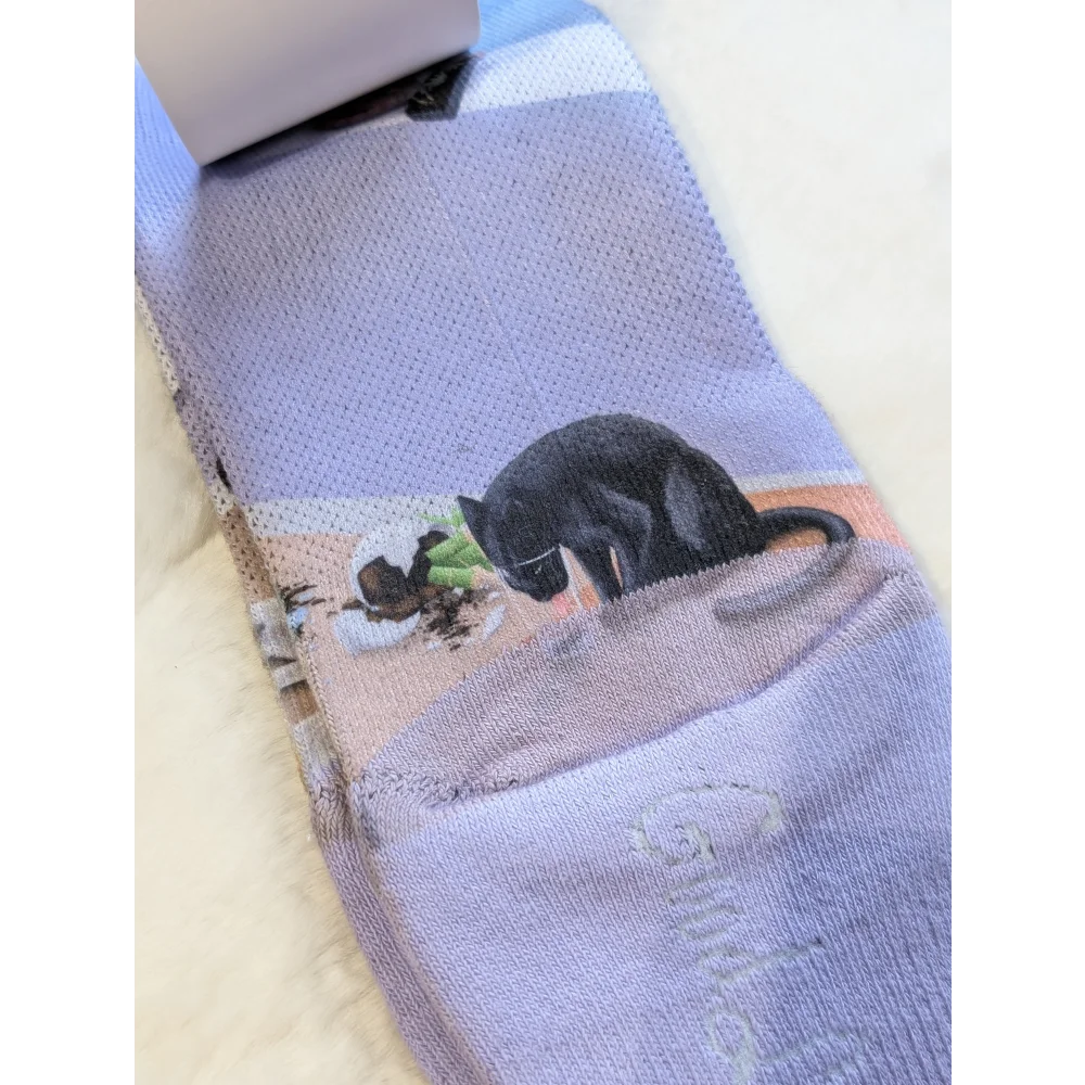 Black cat socks with green leaf design from Good Luck Socks