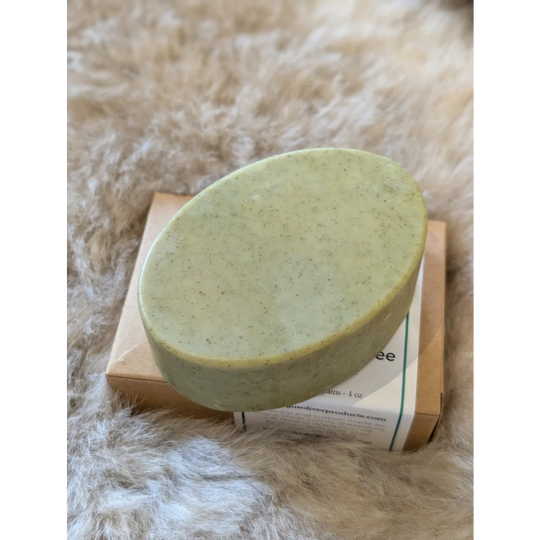 Green speckled nettle and tea tree soap bar on wooden box