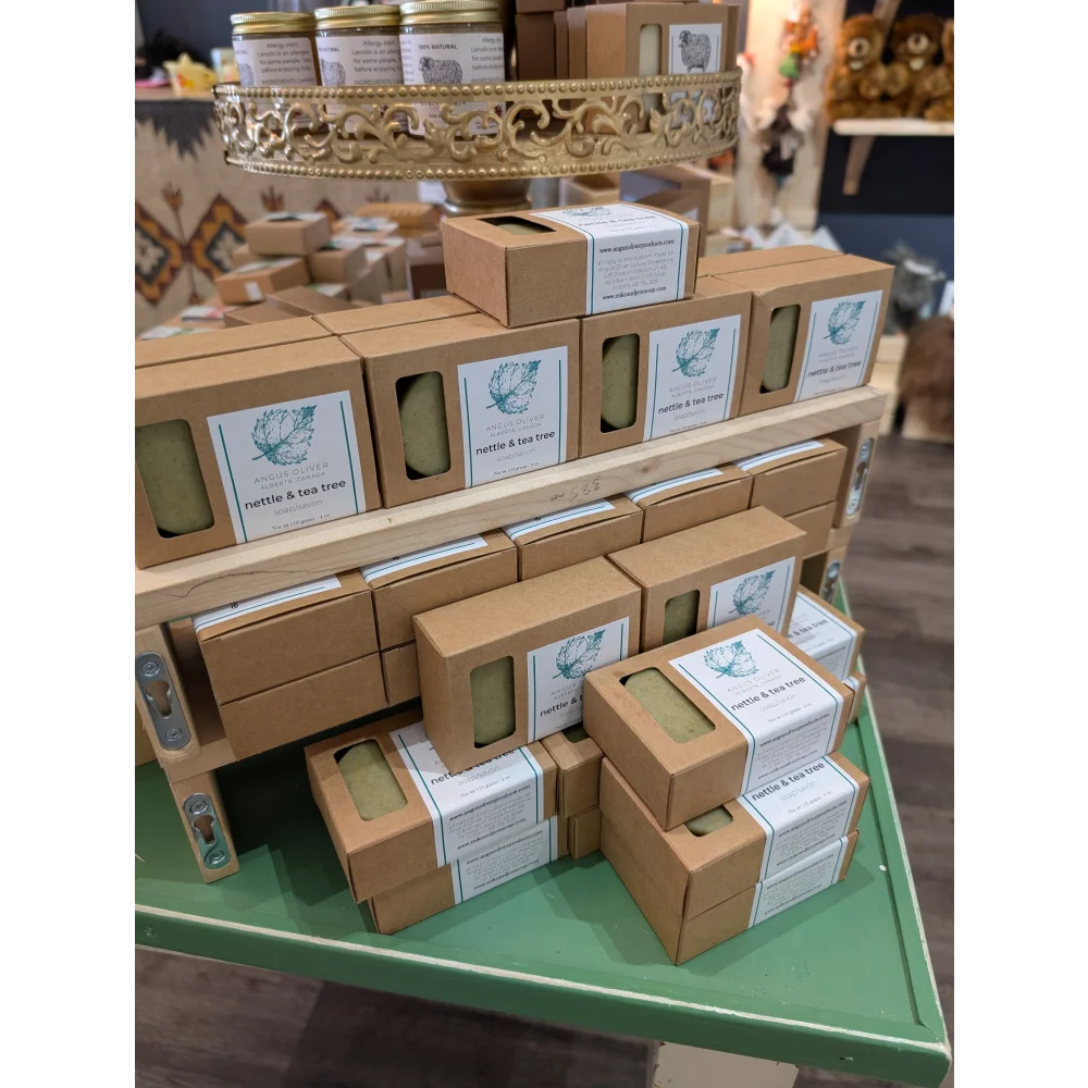 Rustic brown kraft nettle & tea tree soap bar in green-labeled box