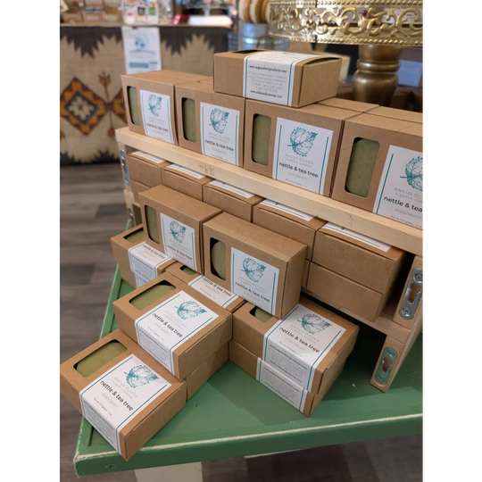 Nettle tea tree soap bar in kraft paper box with teal labels