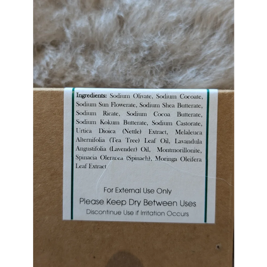 Nettle and tea tree soap bar in brown box with green ingredients