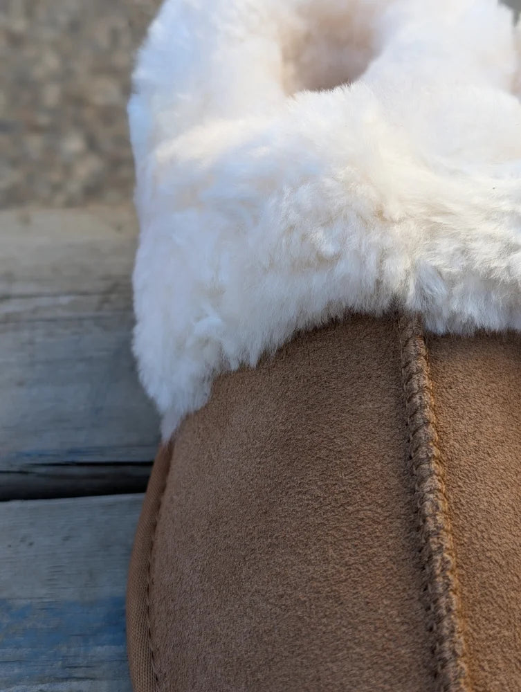 Brown suede sheepskin slippers with plush white shearling lining offering the ultimate sheepskin comfort
