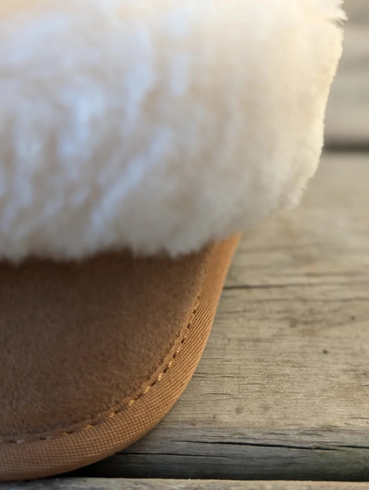 Tan suede ultimate sheepskin slippers with plush white shearling lining for cozy indoor comfort
