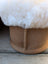Tan suede slip-on boot with plush white shearling lining perfect for ultimate sheepskin slippers comfort