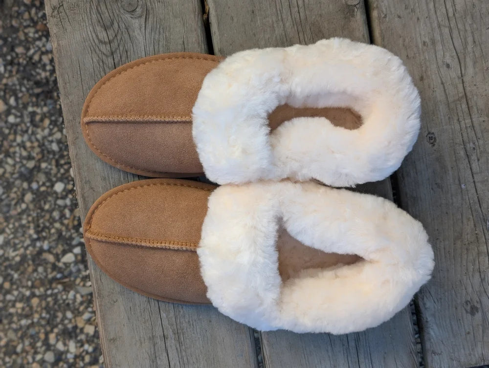 Tan suede slip-on sheepskin slippers with plush white shearling lining for ultimate sheepskin comfort
