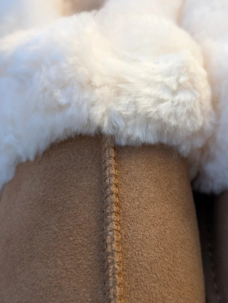 New the ultimate in sheepskin slippers tan suede boot with plush white shearling lining and center seam detail