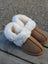 Tan suede slip-on sheepskin slippers with plush white shearling lining the ultimate sheepskin cozy choice