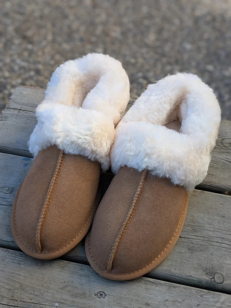 Tan suede slip-on ultimate sheepskin slippers with plush white faux fur lining and trim for cozy wear