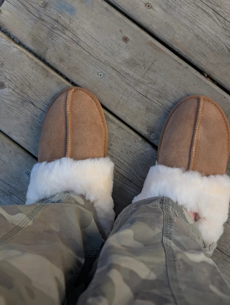 Tan suede ugg-style slip-on mules with plush white shearling lining perfect as ultimate sheepskin slippers