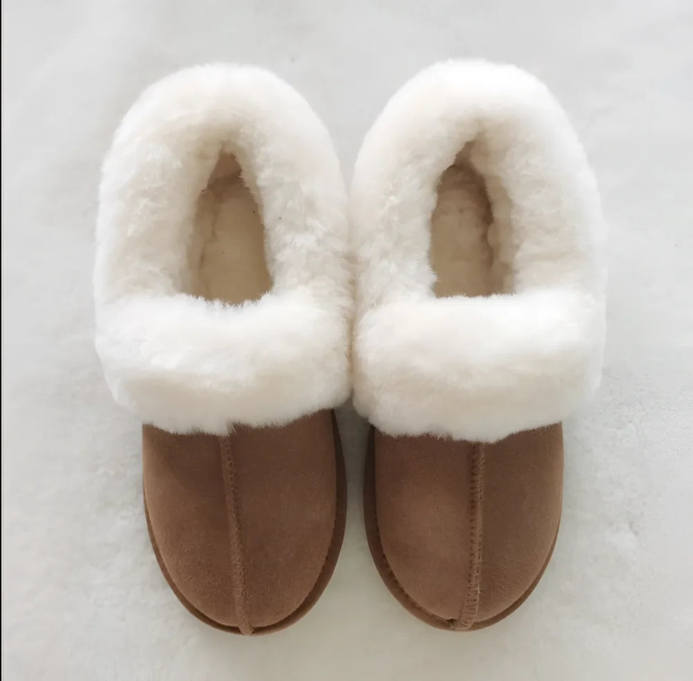 Brown suede slip-on sheepskin slippers with plush white shearling lining for cozy fall comfort