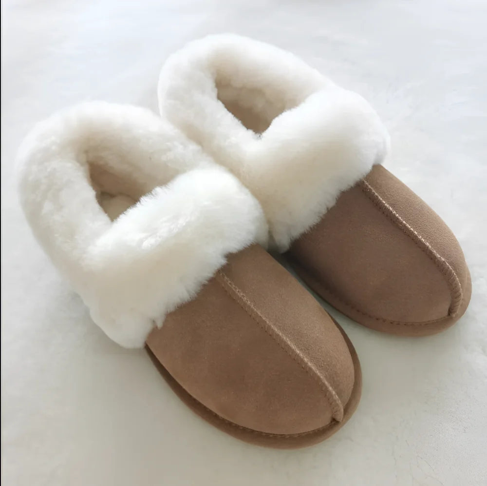 Tan suede slip-on sheepskin slippers with plush white shearling lining perfect for cozy fall wear