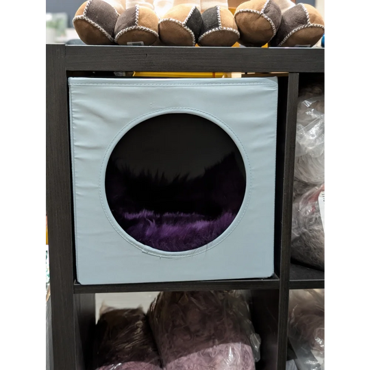 Light blue square cat house with plush purple interior made from merino sheepskins fits ikea kallax boxes