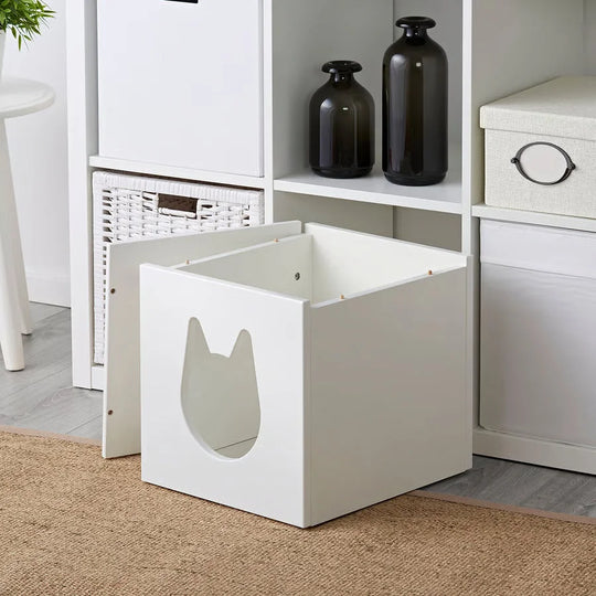 White cat-shaped litter box with smooth painted surfaces designed to fit ikea kallax boxes using merino sheepskins