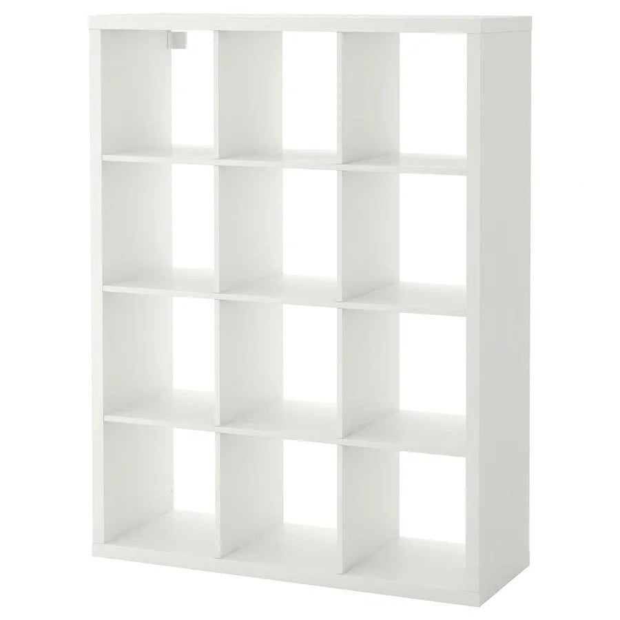 White kallax shelving unit with twelve square compartments paired with a merino sheepskin cat pad meeting strict european standards