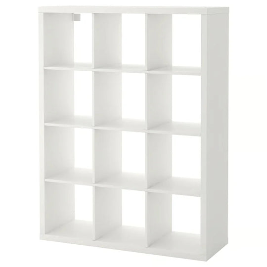 White kallax shelving unit with twelve square compartments paired with a merino sheepskin cat pad meeting strict european standards